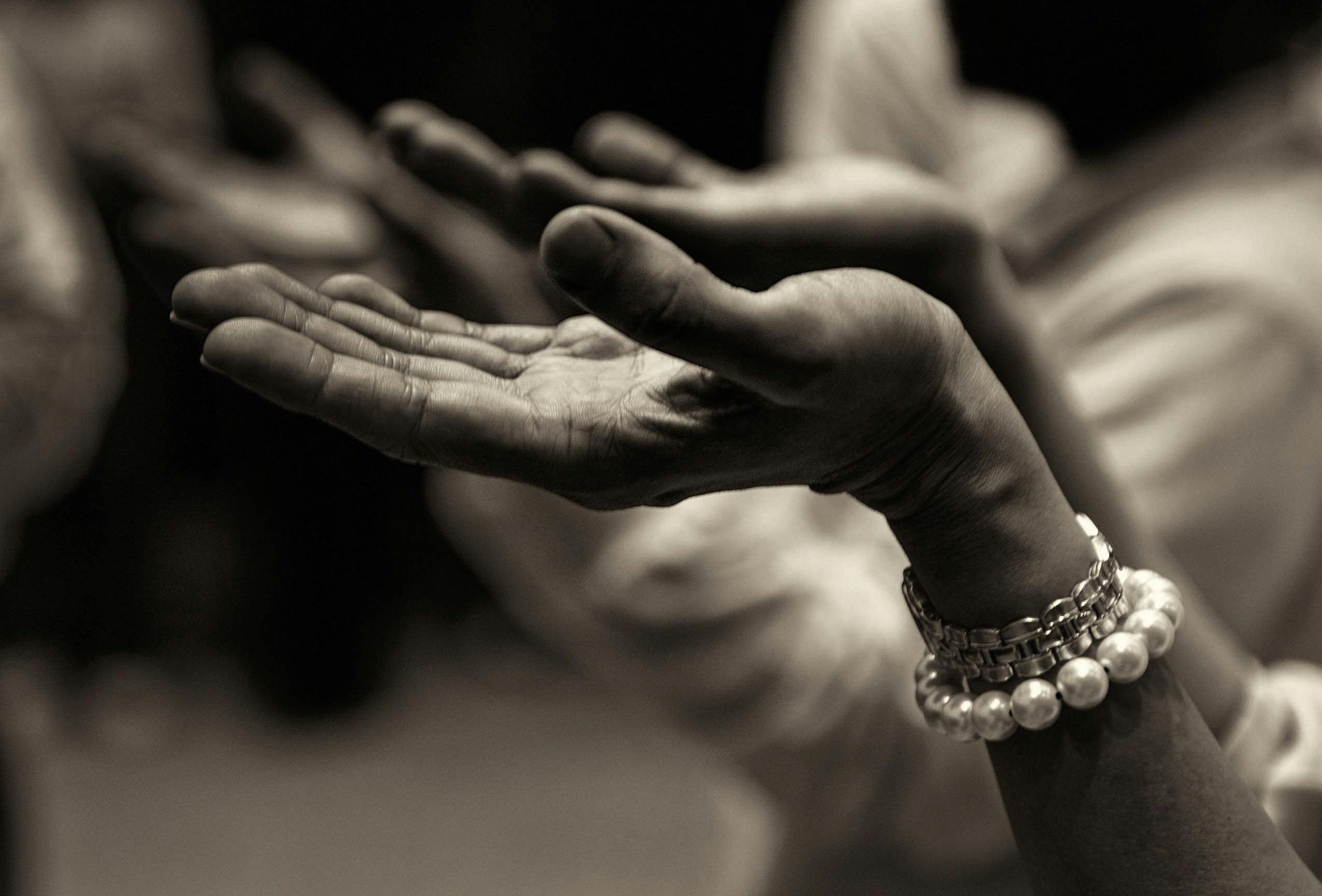 pexels photo 257037 257037 Our Ministry: Close-up of expressive hands in prayer wearing a bracelet, conveying faith and devotion.